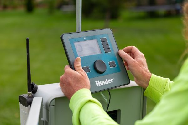 Mill Brothers technician programming a commercial irrigation controller