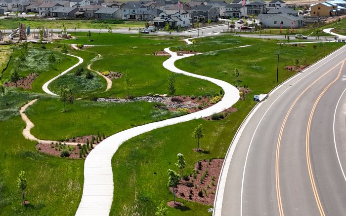 Aerial view of a landscaped community park with walking paths and native plantings